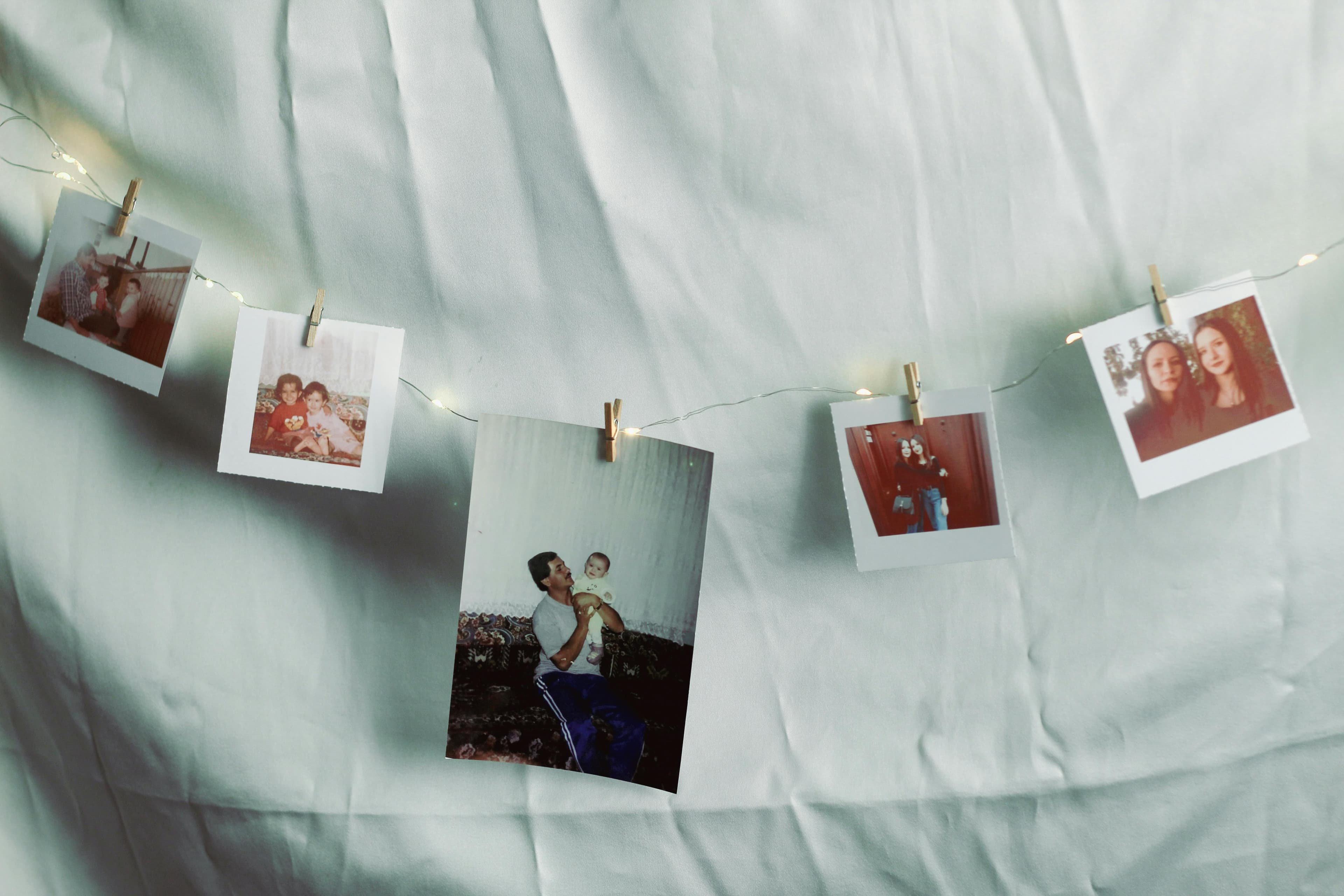 Old family photographs laid out on a table